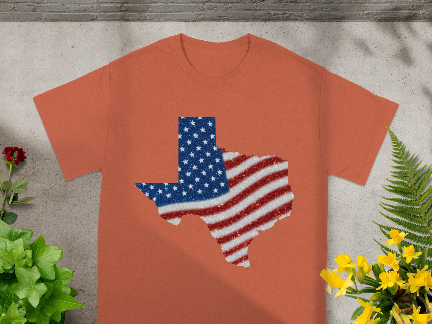 Orange t-shirt with Texas map design featuring the American flag.