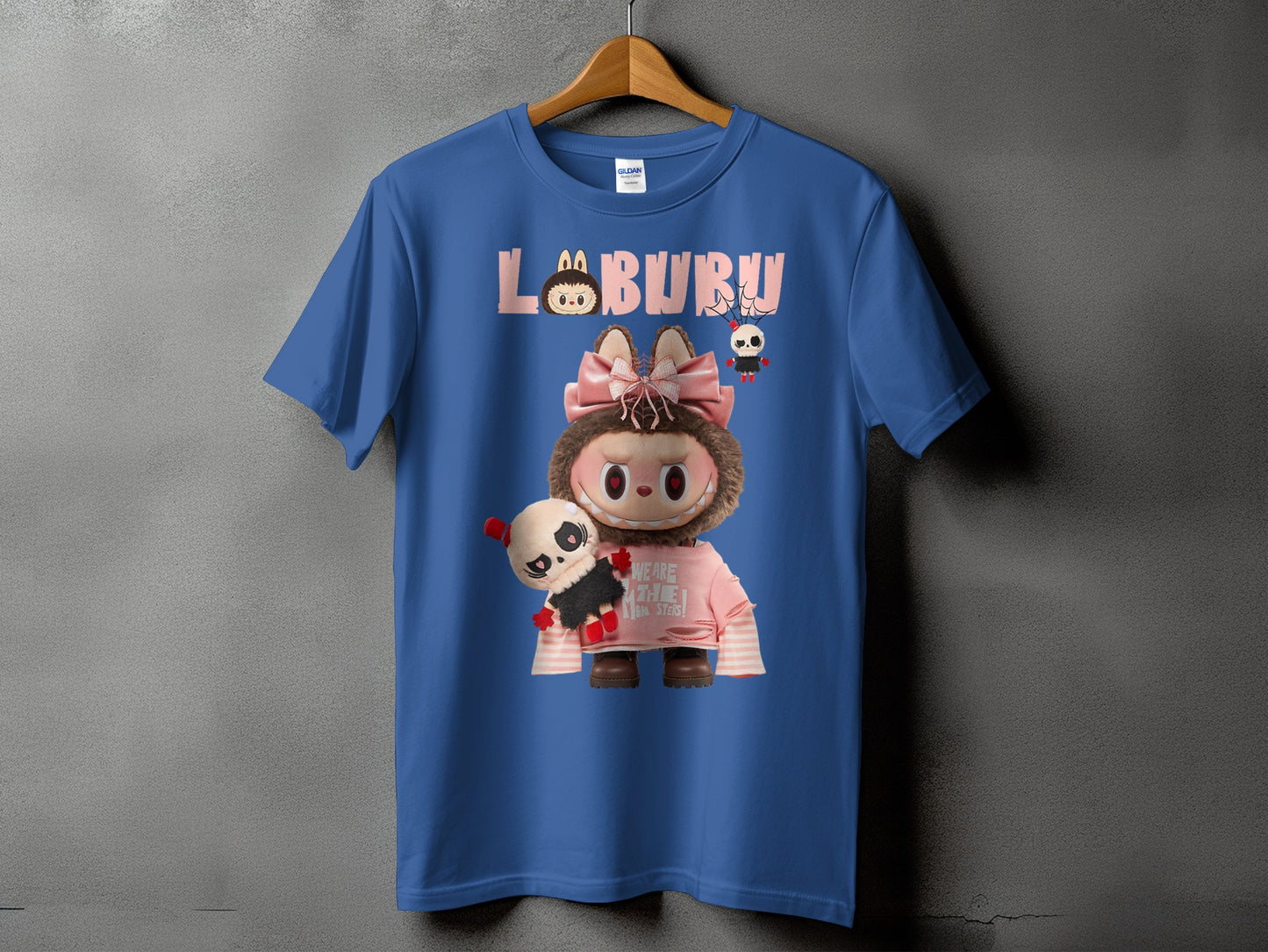 Blue t-shirt with "LABURU" text and a cartoon character holding a panda plush.