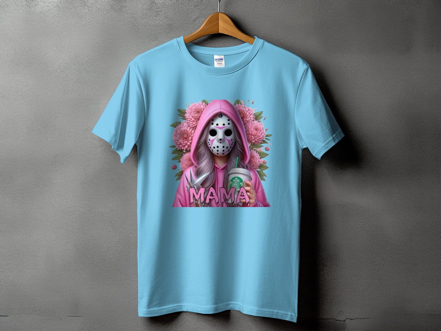 Light blue t-shirt with a graphic of a person in a pink hoodie and Jason mask holding a Starbucks cup.