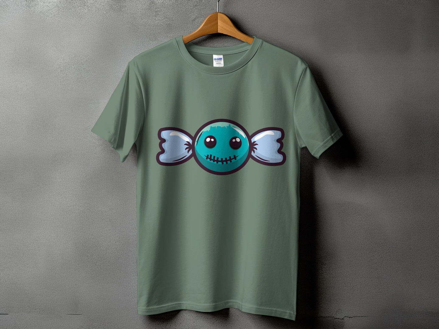 Green t-shirt with a teal candy graphic with stitches and cute eyes.