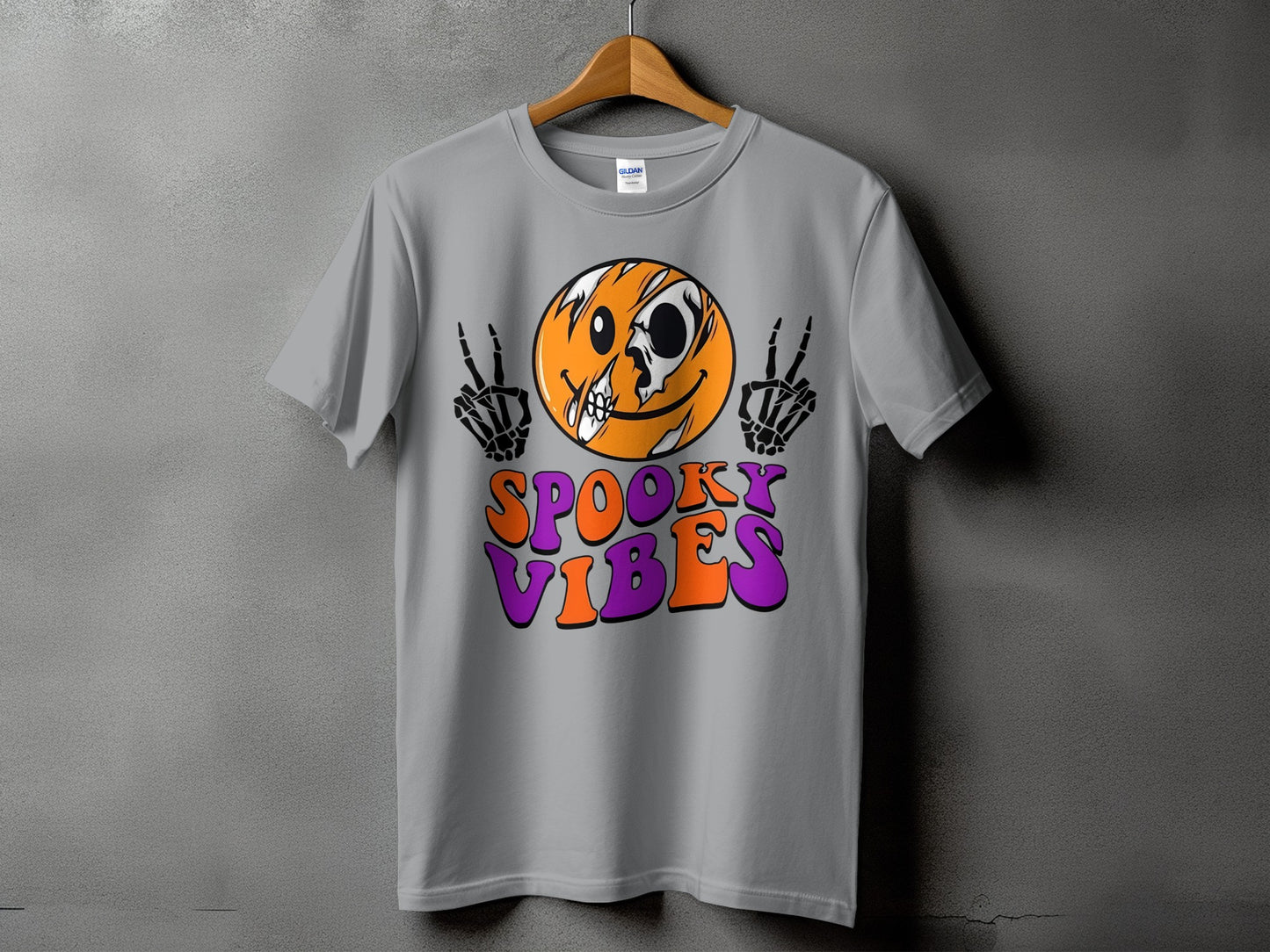 Gray t-shirt with a cracked smiley face, skeleton hands, and "Spooky Vibes" text.
