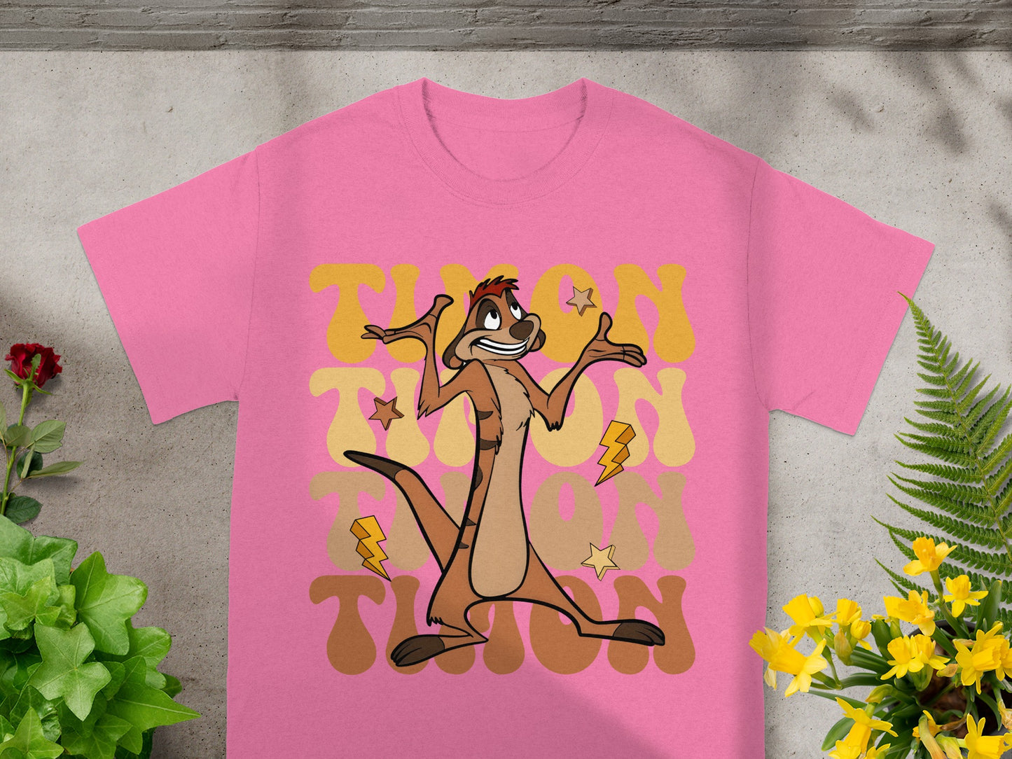 Pink t-shirt with "TIMON" text and cartoon meerkat.