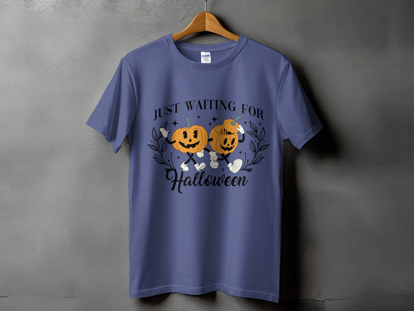 Blue t-shirt with graphic of two pumpkins and text "JUST WAITING FOR Halloween".