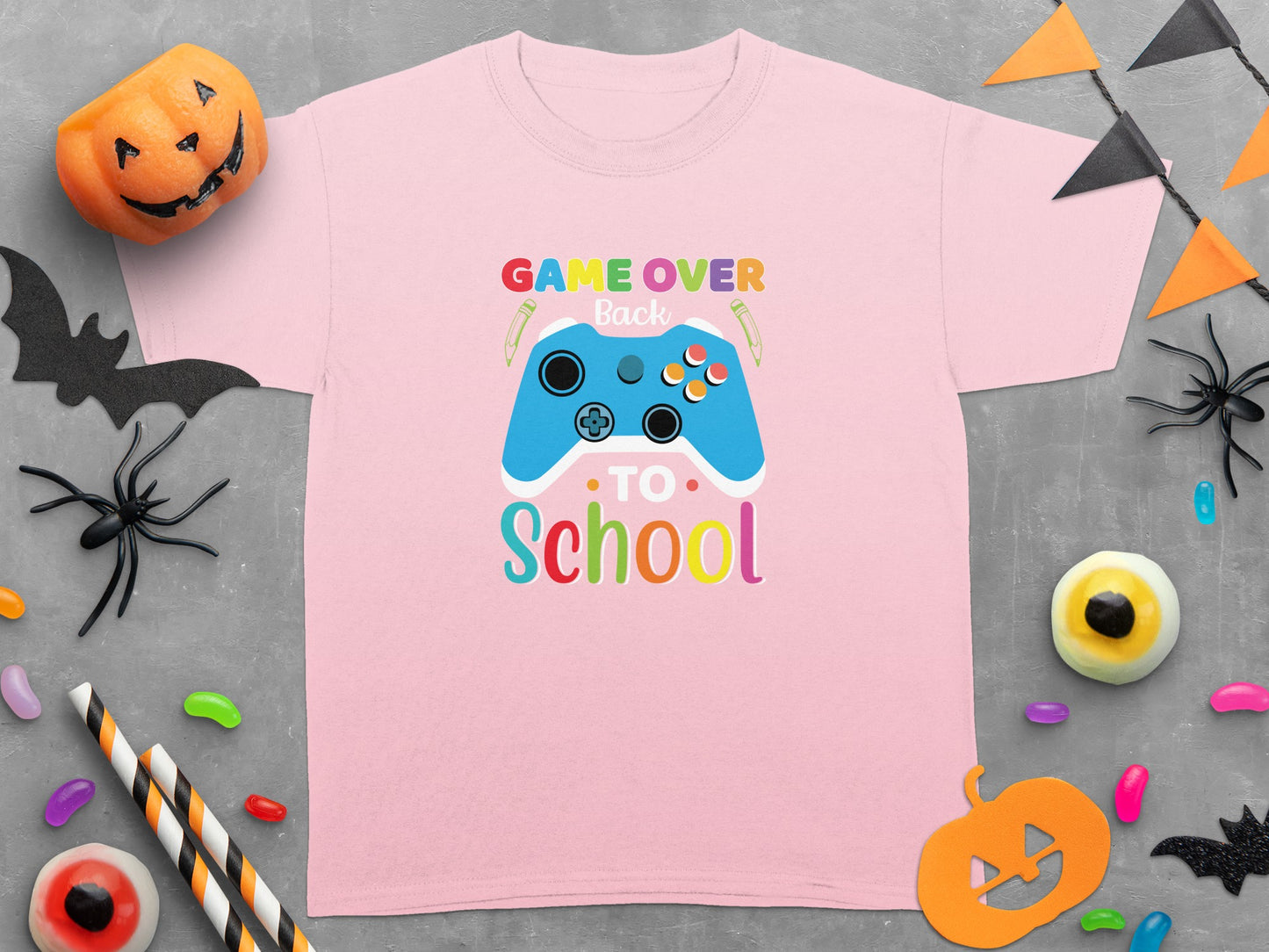 Pink t-shirt with "Game Over Back to School" and blue video game controller.