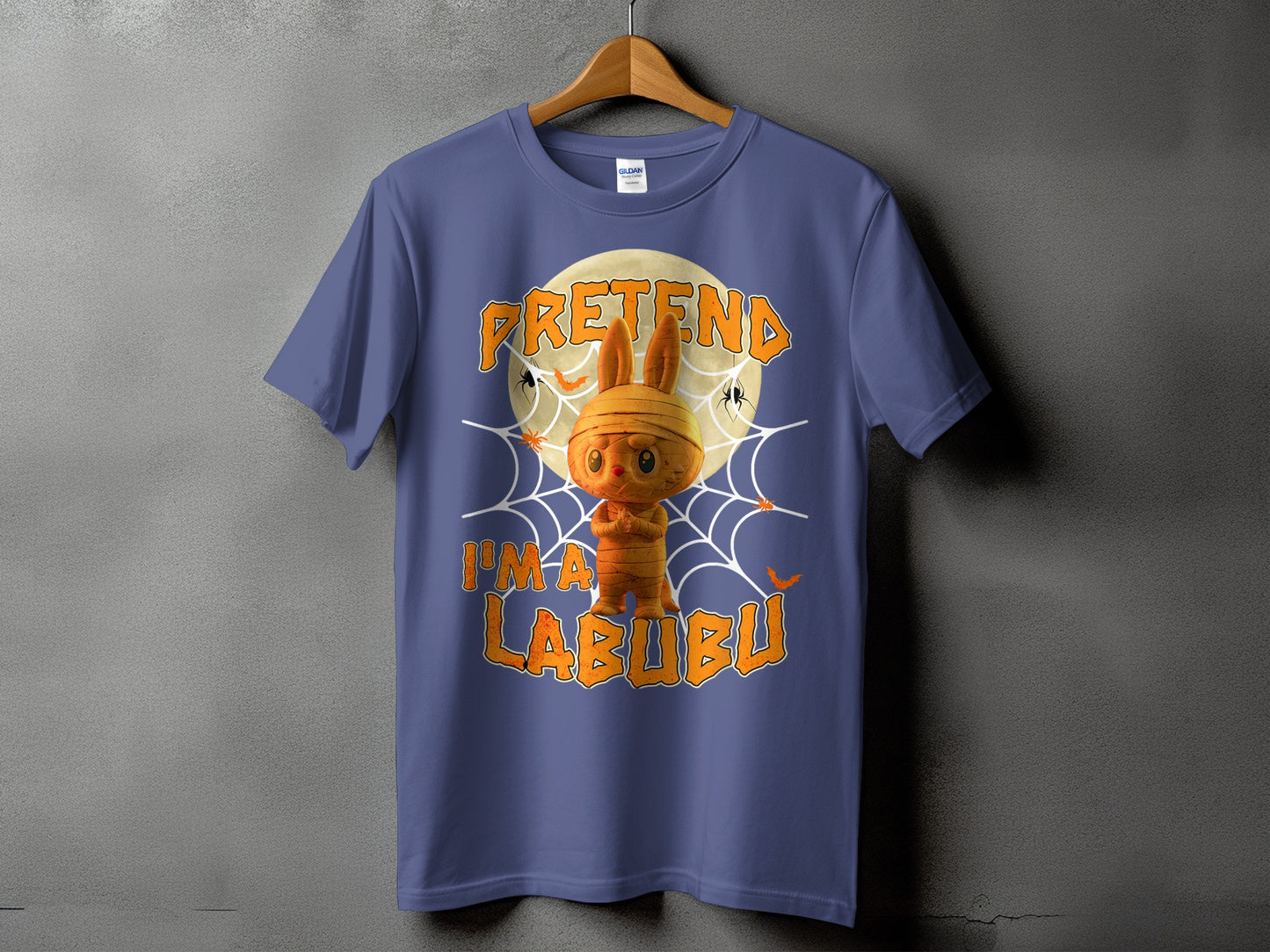 Blue t-shirt with mummy Labubu character and text "PRETEND I'M A LABUBU".