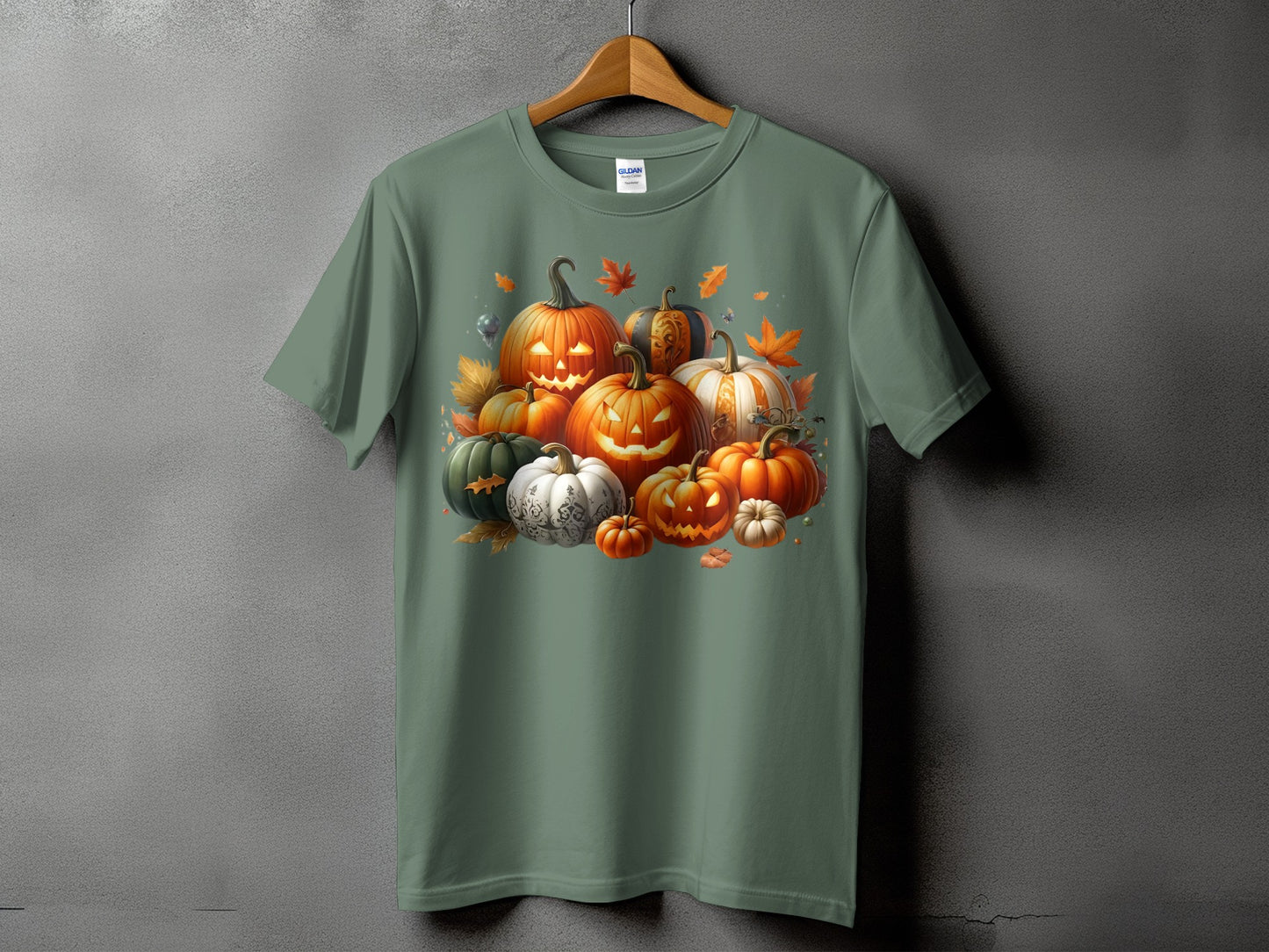 Green t-shirt with a Halloween pumpkin patch graphic and falling autumn leaves.