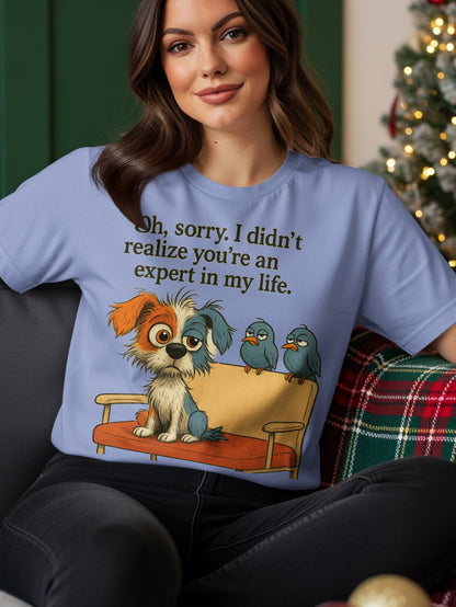 Light blue t-shirt with cartoon dog and two birds, text "Oh, sorry. I didn't realize you're an expert in my life."