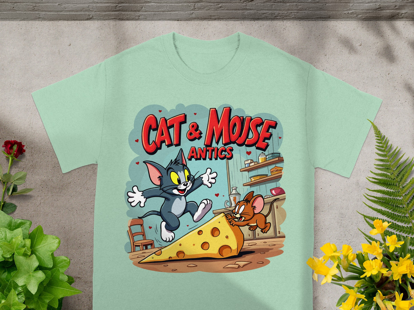 Tom and Jerry on cheese slice with "CAT & MOUSE ANTICS" text.