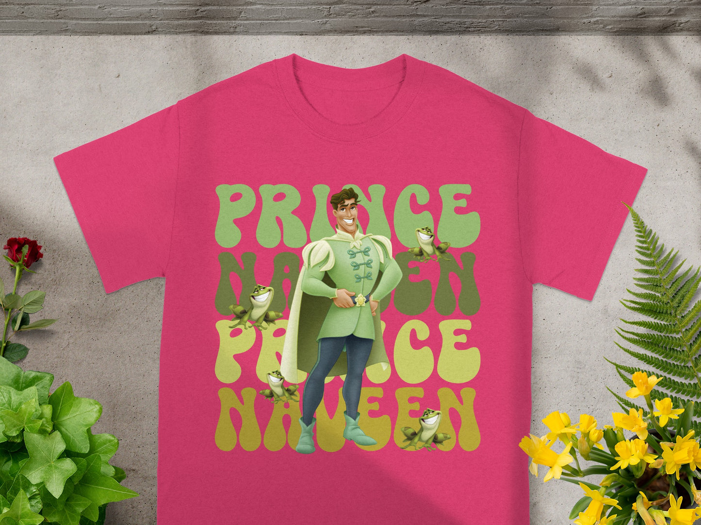 Pink t-shirt with a cartoon prince and frogs, "Prince Nineteen" text.