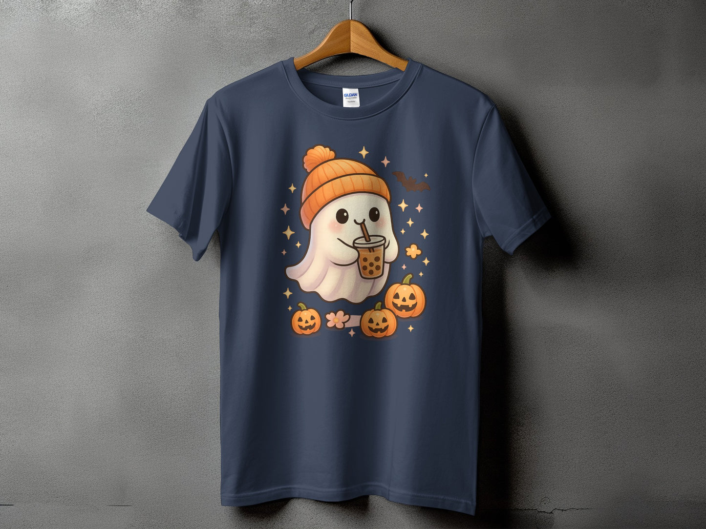 T-shirt with a cute ghost wearing a beanie holding bubble tea and surrounded by pumpkins.