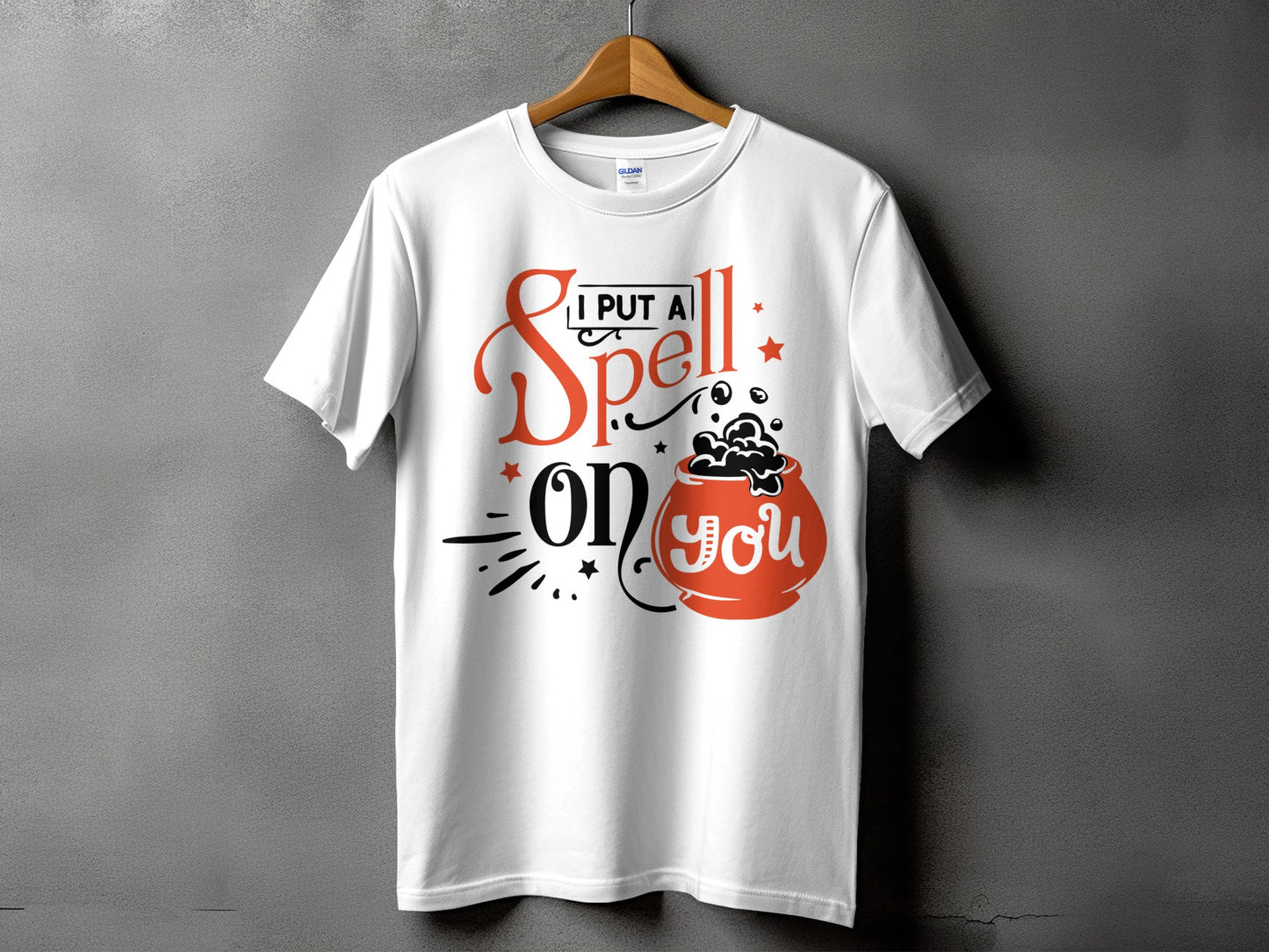 White t-shirt with Halloween graphic "I Put A Spell On You" and cauldron.
