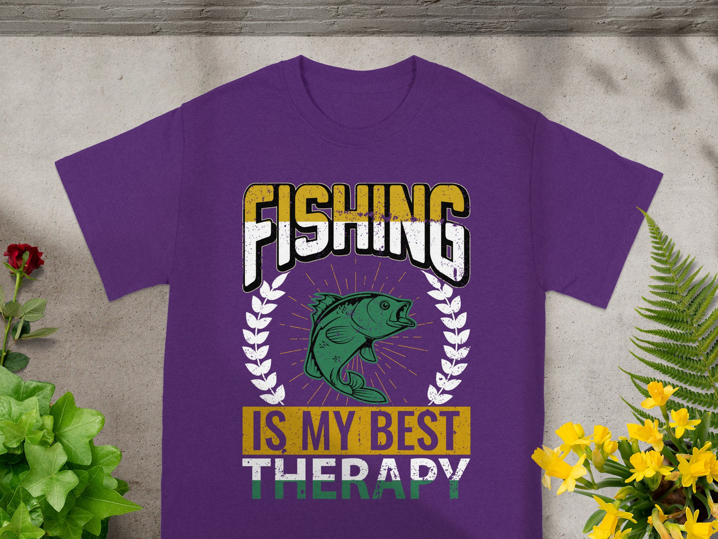 Purple t-shirt with "FISHING IS MY BEST THERAPY" text and fish graphic.