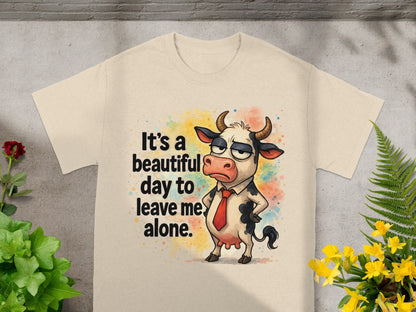 Cream t-shirt with cartoon cow saying "It's a beautiful day to leave me alone."