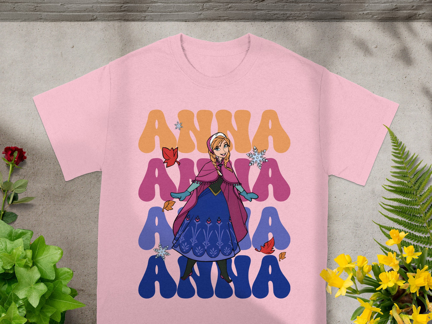 Pink t-shirt with Anna from Frozen graphic and "ANNA" text.