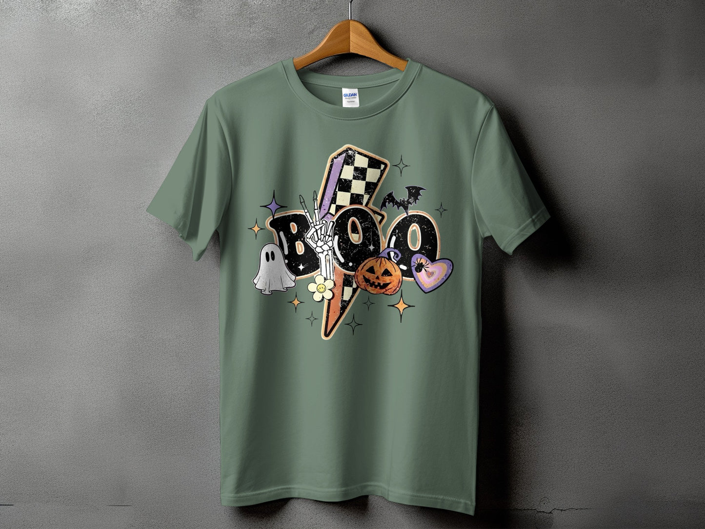 Green t-shirt with "Boo" graphic featuring a ghost, skeleton hand, pumpkin, and bat.