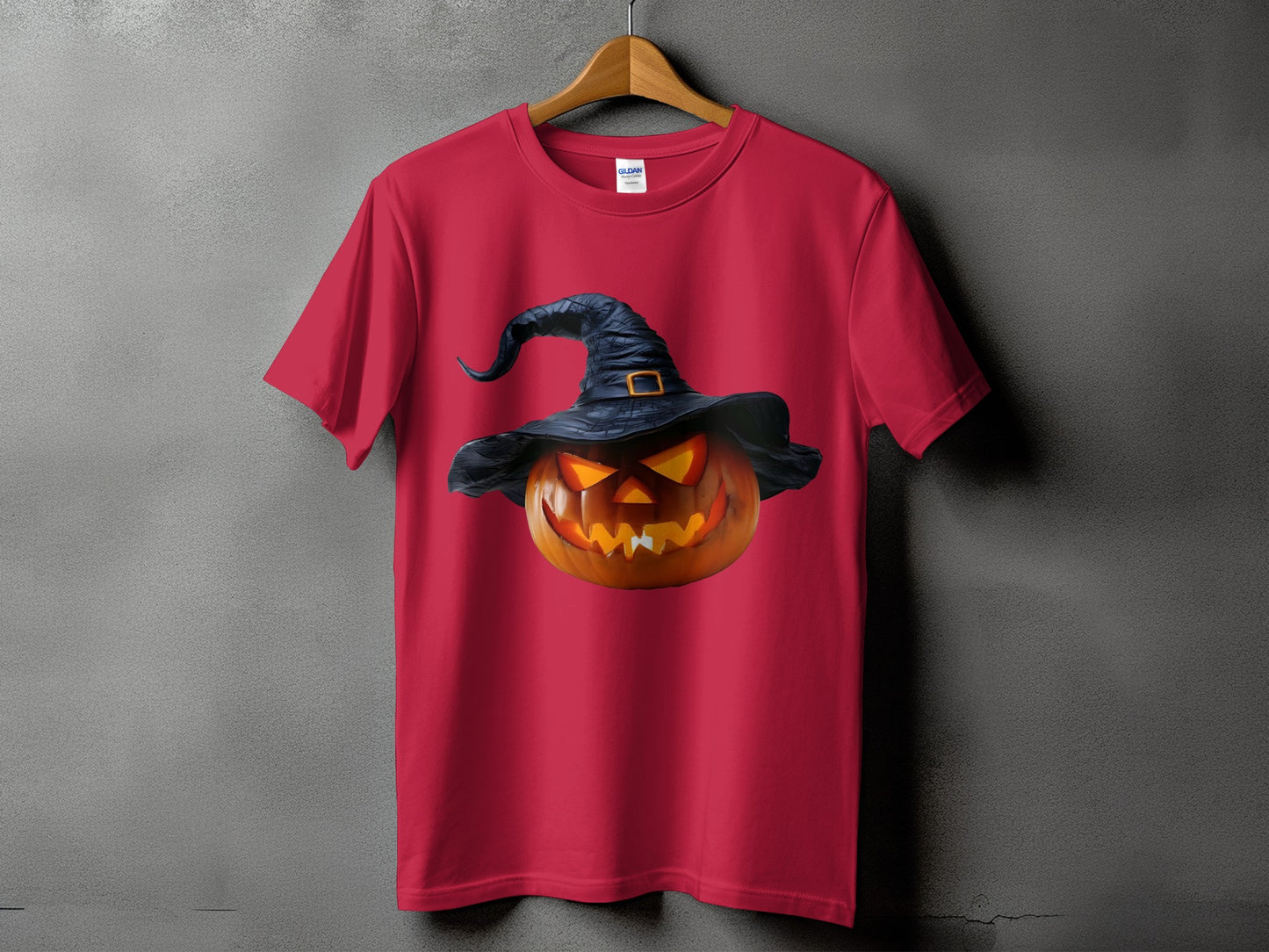 Red t-shirt with a Halloween pumpkin wearing a witch hat graphic.