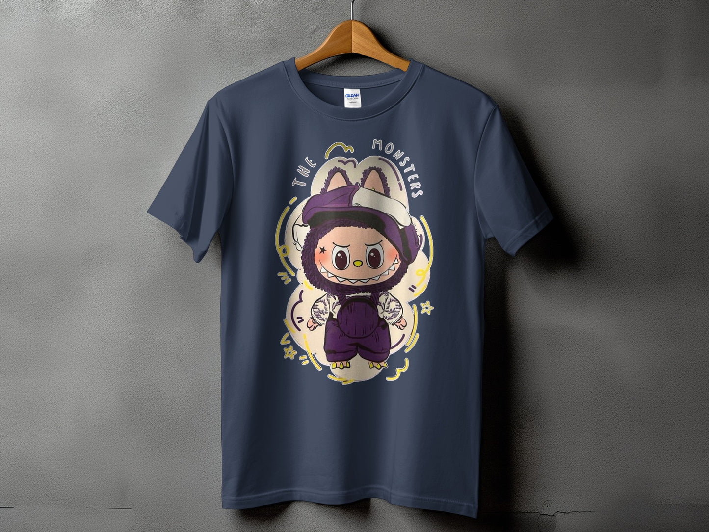 Dark navy t-shirt with a cartoon monster graphic and the text "The Monsters."