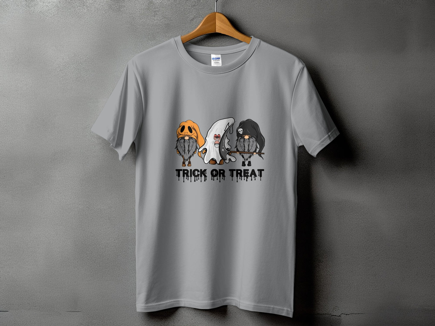 Grey t-shirt with three gnomes dressed for Halloween and the text "Trick or Treat".