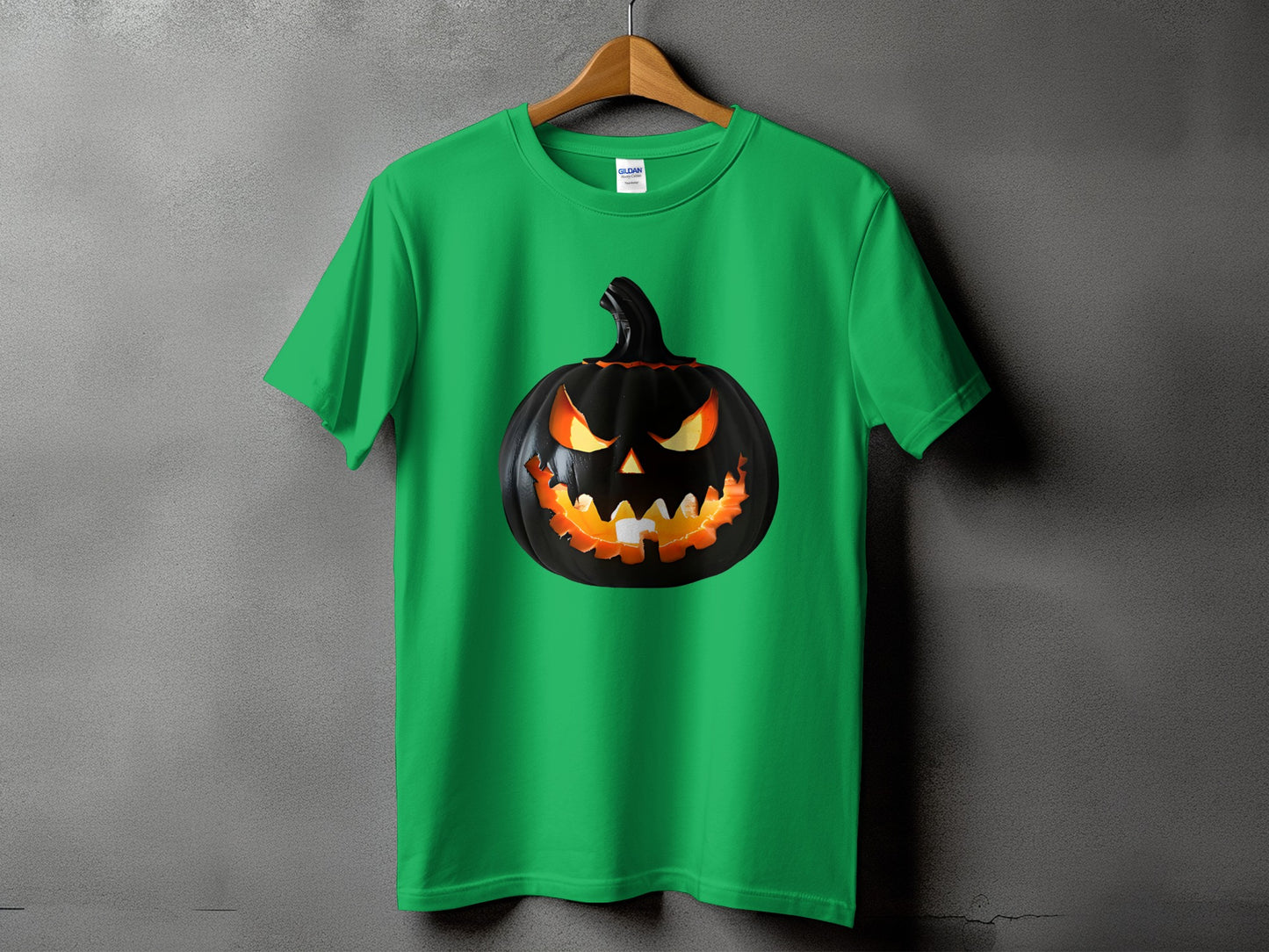 Green t-shirt with a black jack-o'-lantern graphic design.