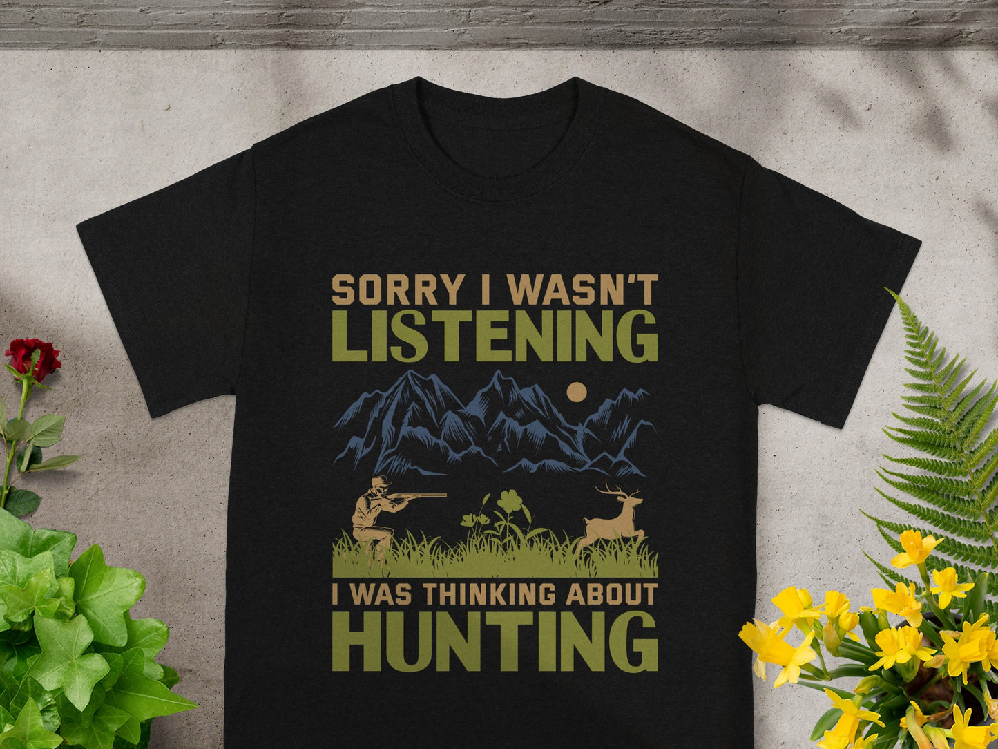 Black t-shirt with text "Sorry I wasn't listening, I was thinking about hunting" and a hunting scene.