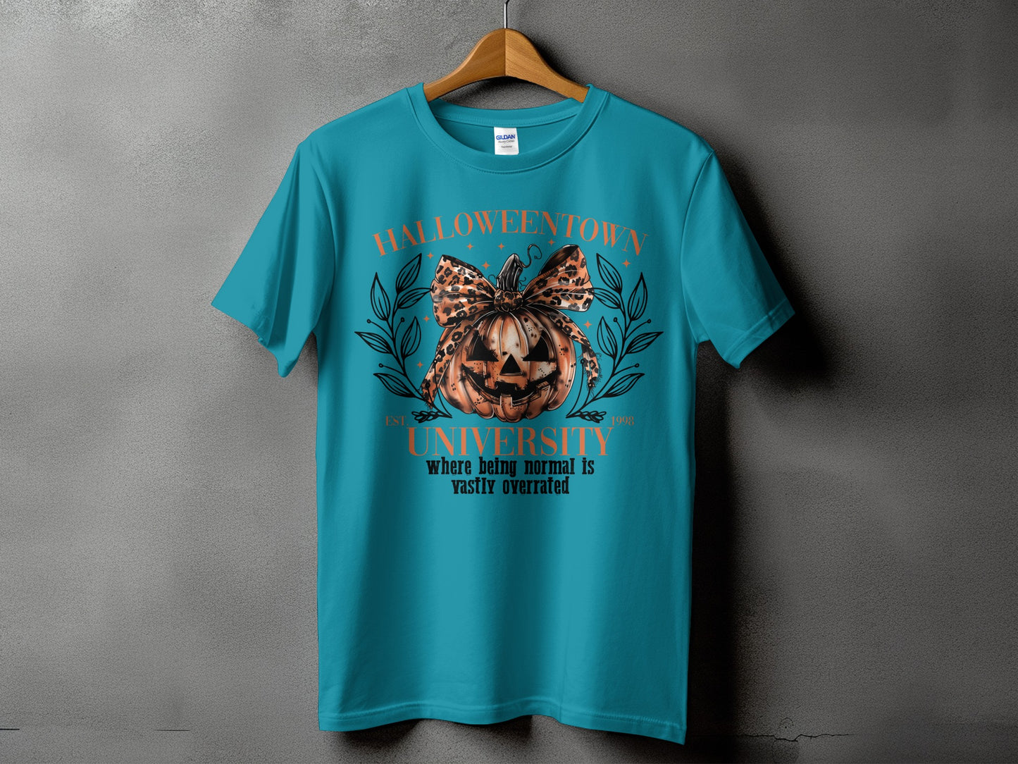 Teal t-shirt with "Halloweentown University" and pumpkin graphic.