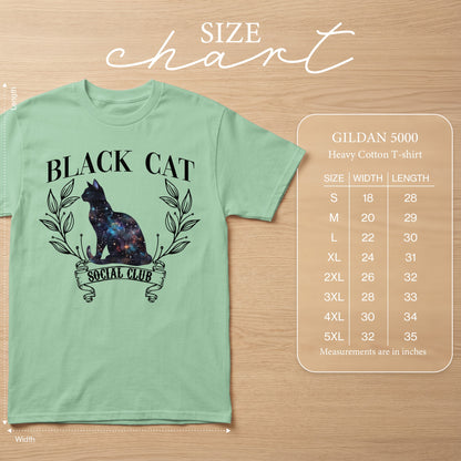 Light green t-shirt with galaxy cat graphic and size chart.