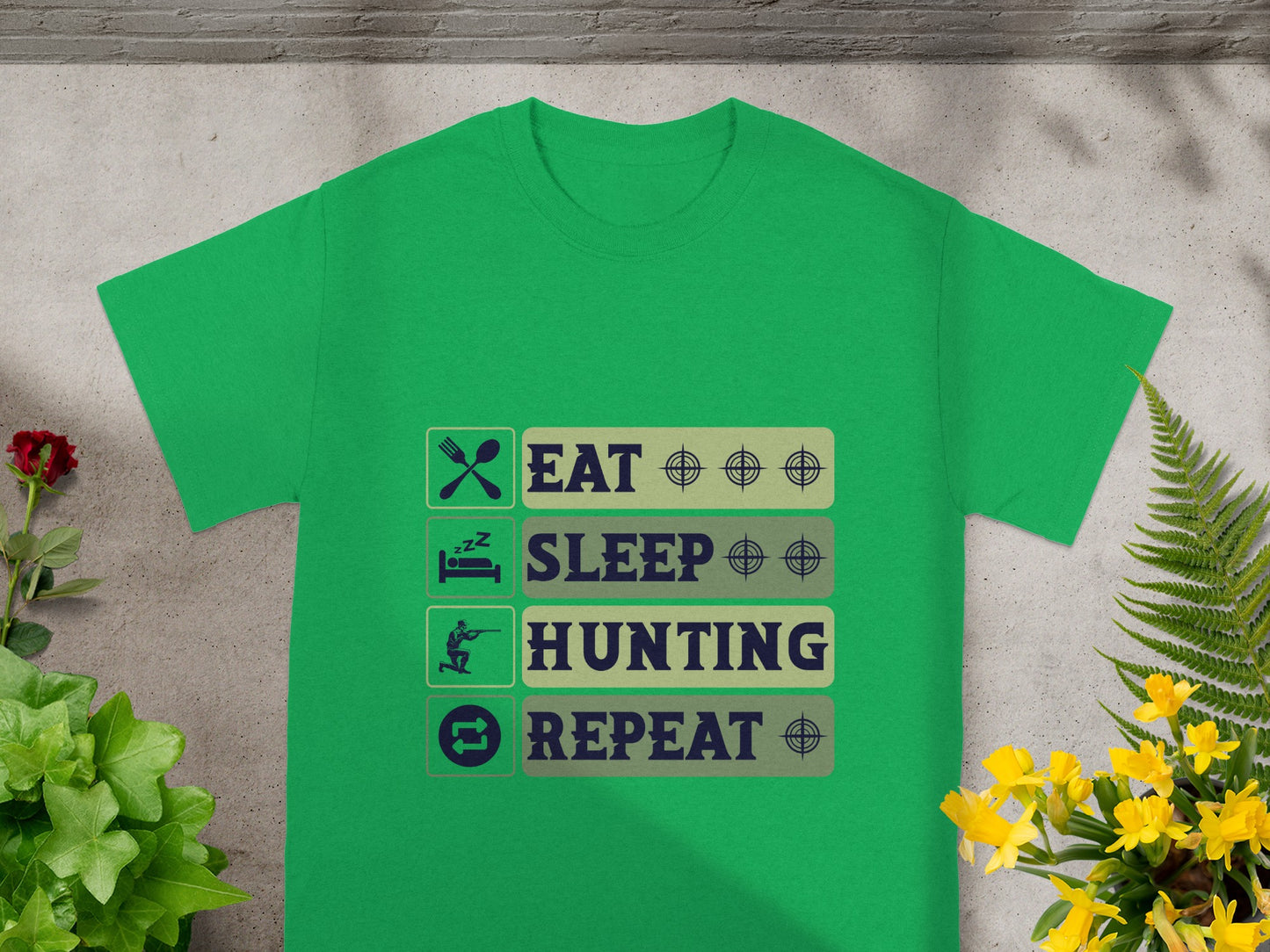 Green t-shirt with "Eat Sleep Hunting Repeat" graphic design elements.