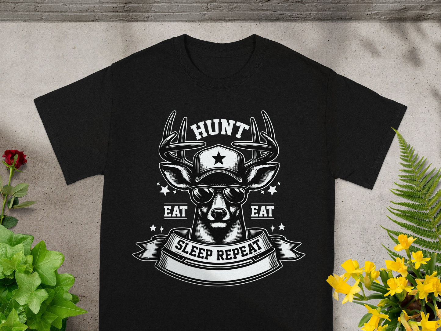 Black t-shirt with deer graphic and text: HUNT, EAT, SLEEP REPEAT.