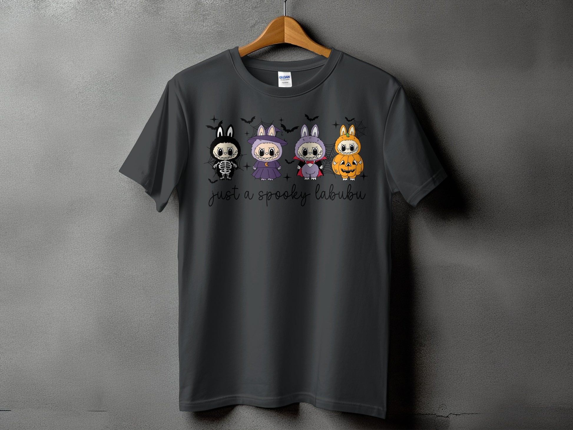 Dark grey t-shirt with four Halloween-themed characters and "just a spooky labubu" text.
