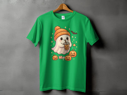 Green t-shirt with cute ghost in orange hat holding bubble tea, surrounded by pumpkins.