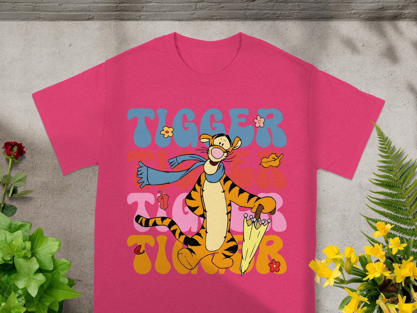 Tigger graphic tee with "Tigger" text and yellow umbrella.