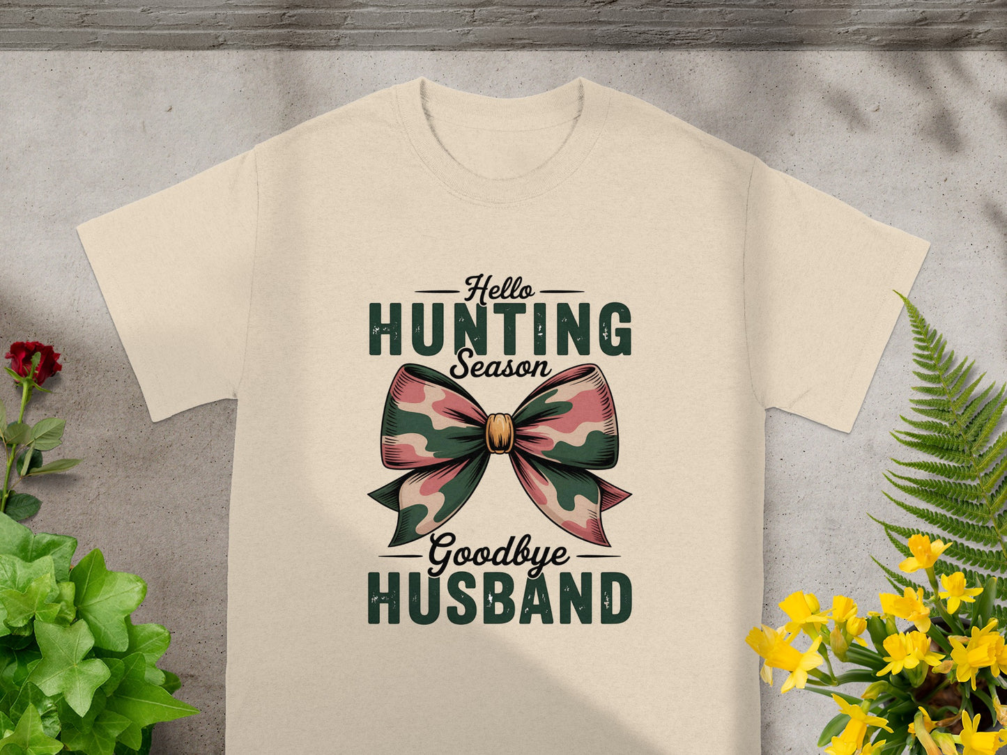 Cream t-shirt with "Hello Hunting Season Goodbye Husband" text and a camouflage bow graphic.