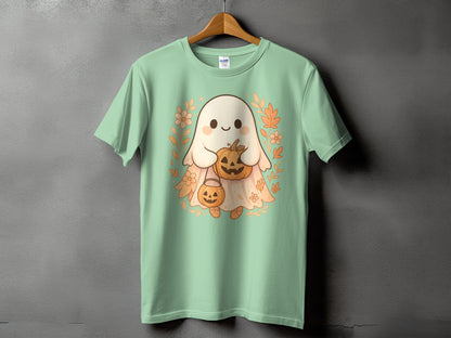 Light green t-shirt with a kawaii ghost holding pumpkins and surrounded by fall leaves.