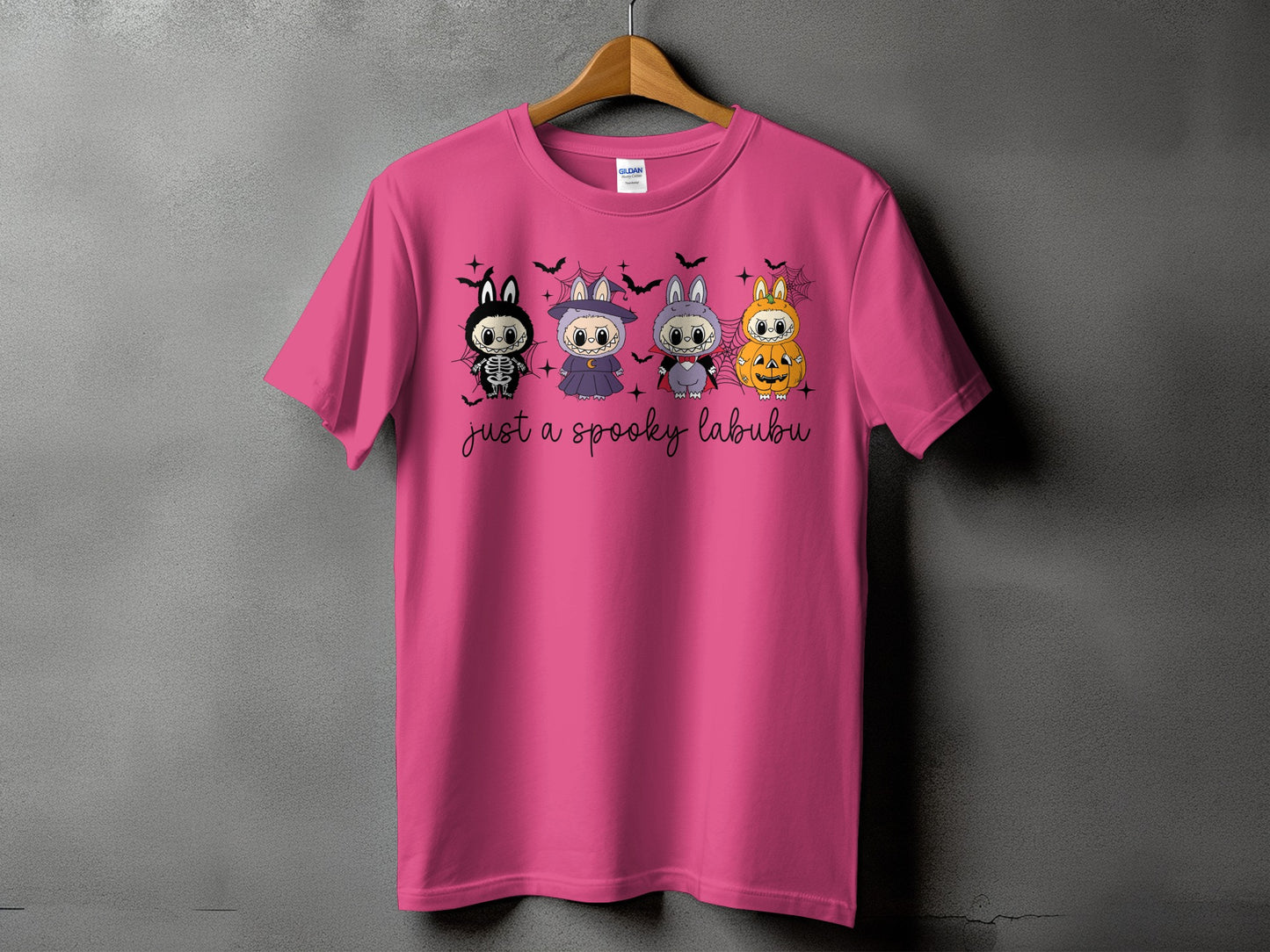 Pink t-shirt with Halloween-themed Labubu characters and "just a spooky labubu" text.