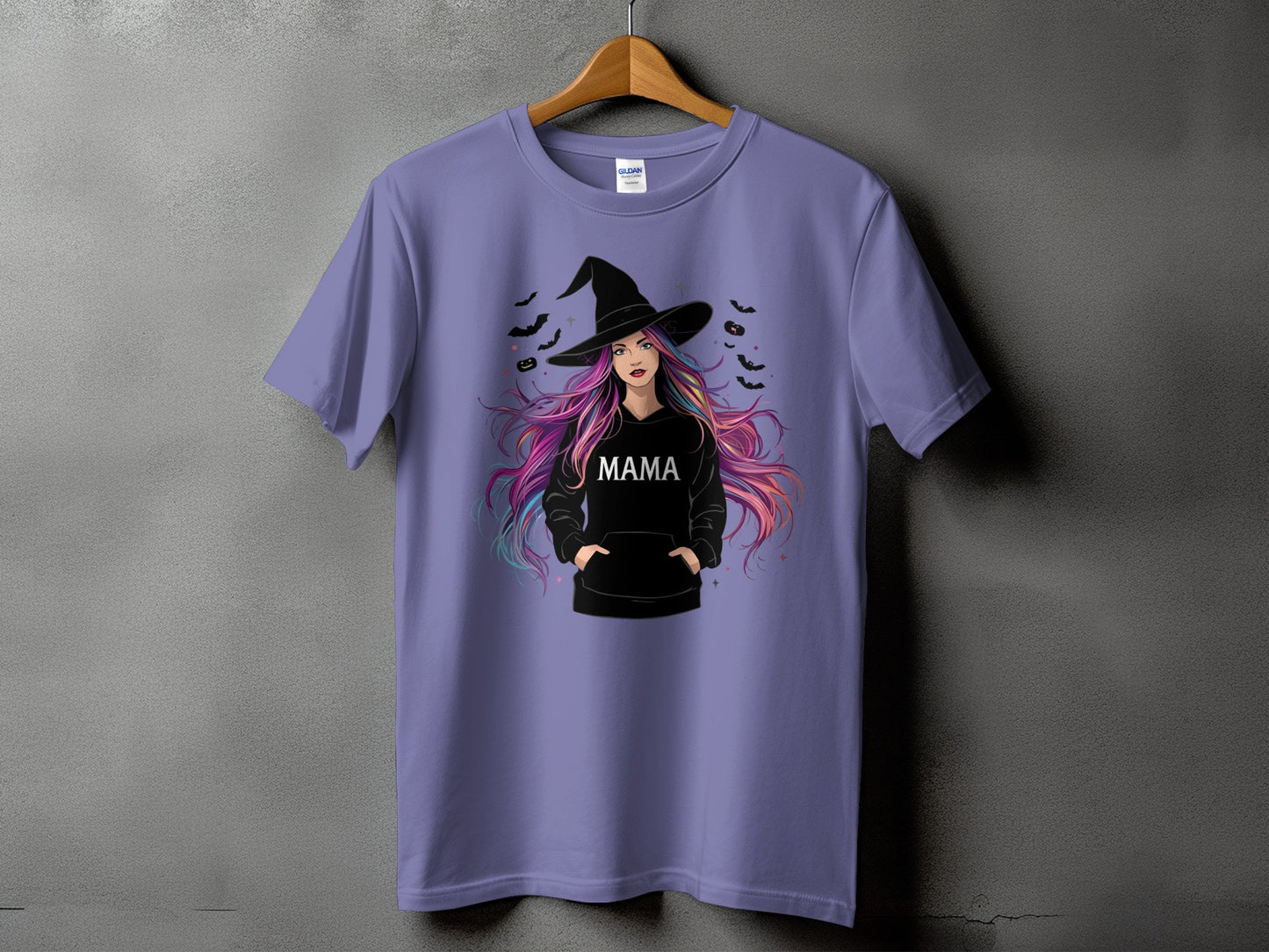 Purple t-shirt with witch graphic wearing a black hoodie with "MAMA" text.