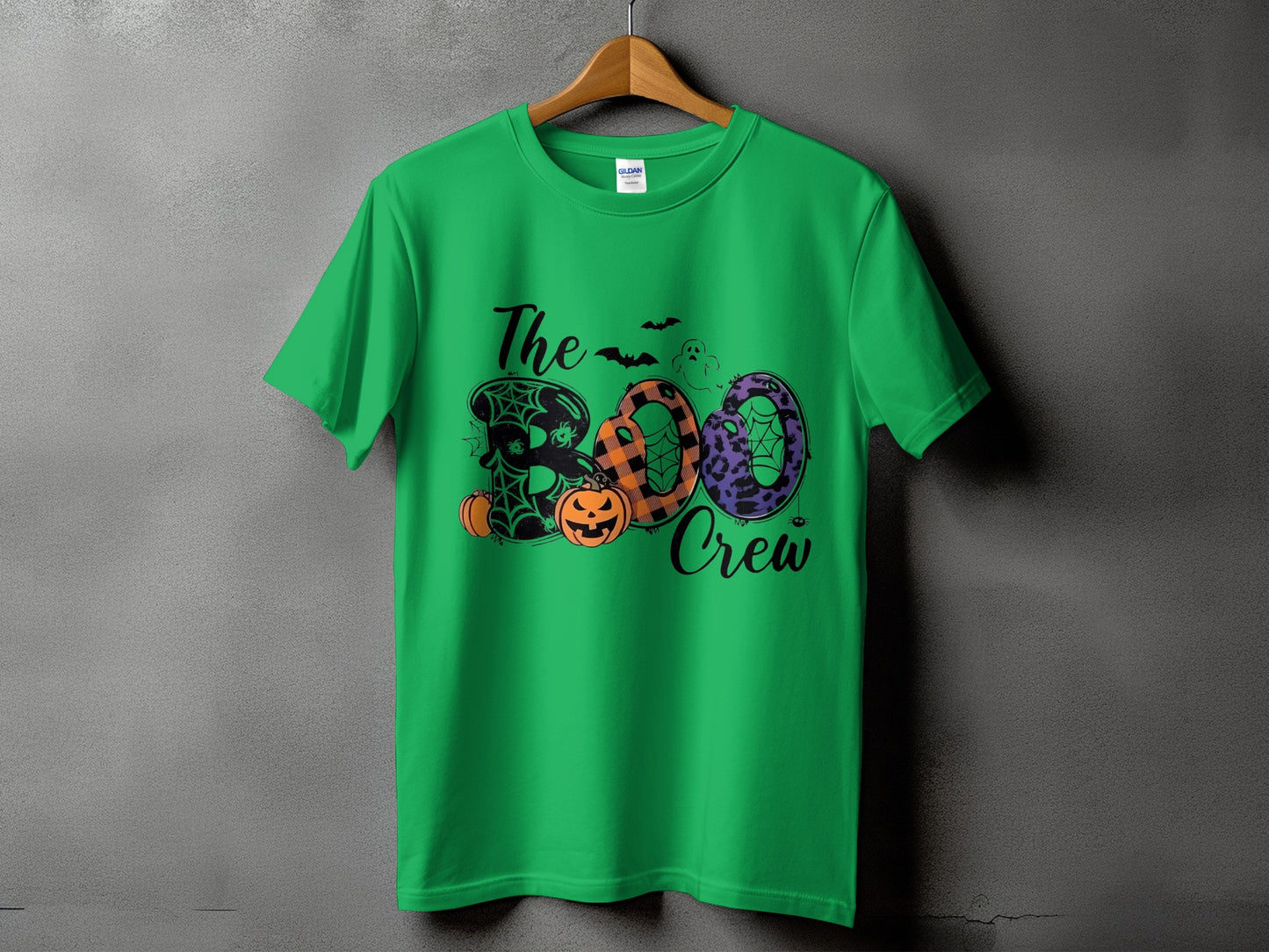 Green t-shirt with "The Boo Crew" Halloween graphic featuring pumpkins and bats.