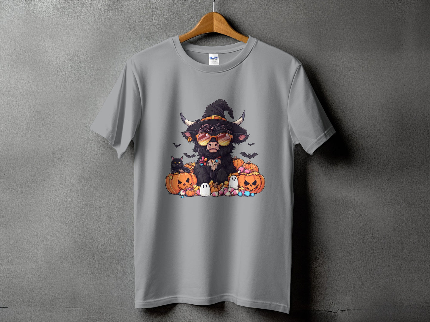 Highland cow in witch hat and sunglasses with pumpkins, ghosts, and cats.