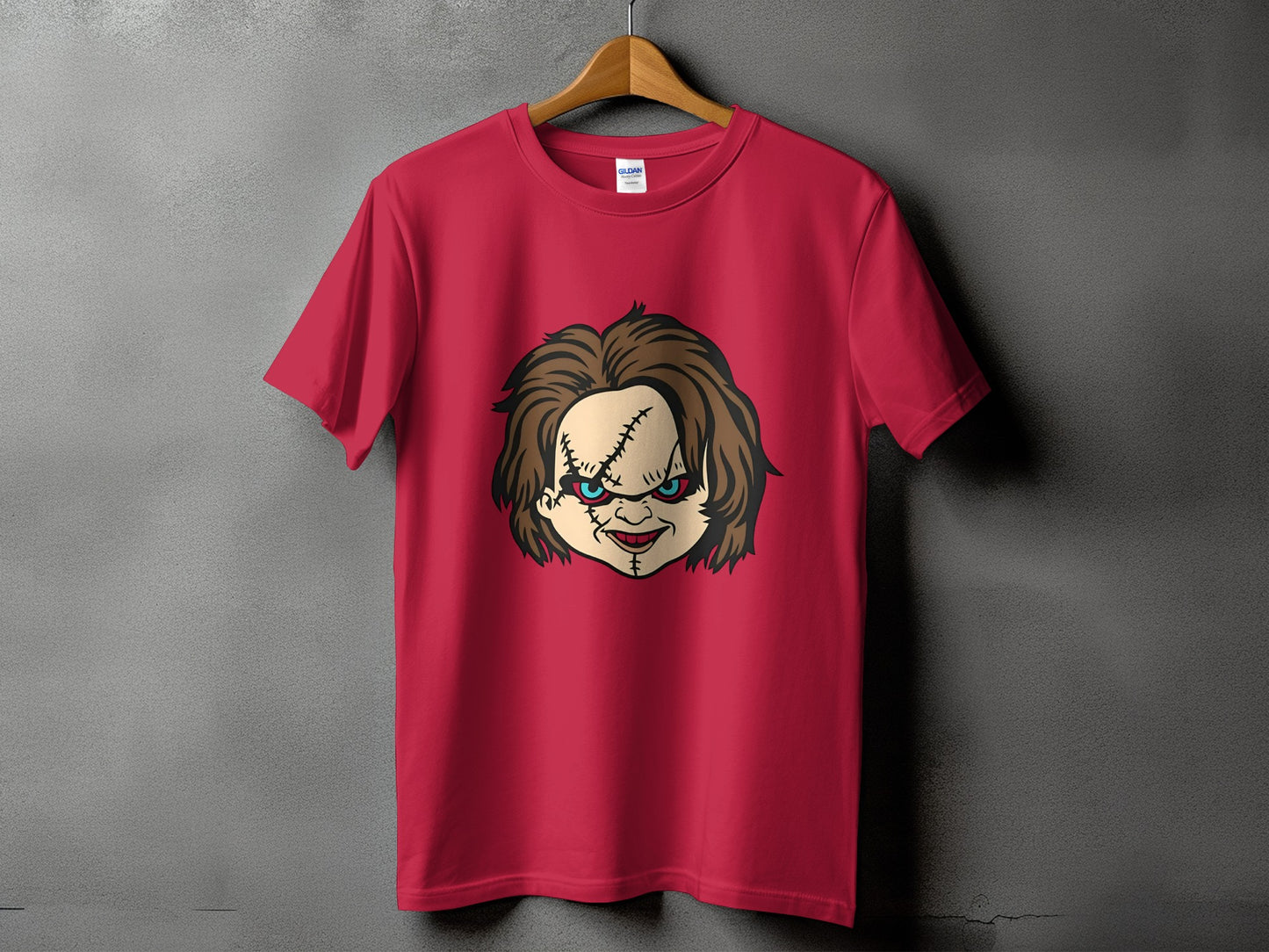 Red t-shirt with a Chucky doll face graphic on the front.