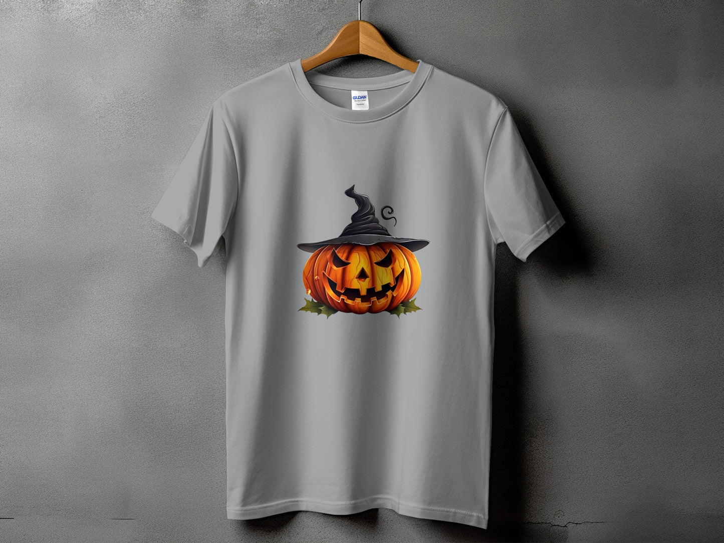Gray t-shirt featuring a carved Halloween pumpkin wearing a witch hat.