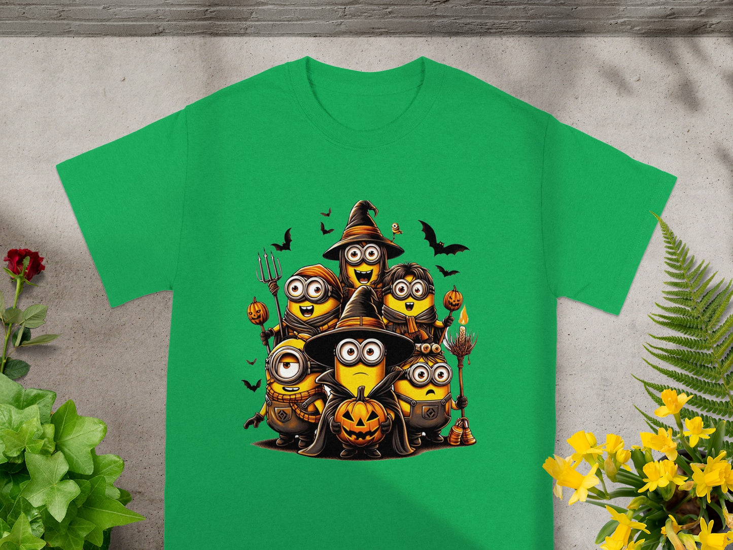 Halloween Minions wearing witch hats and holding pumpkins and brooms.