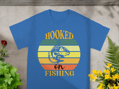 Blue t-shirt with "Hooked on Fishing" text and a fish design.