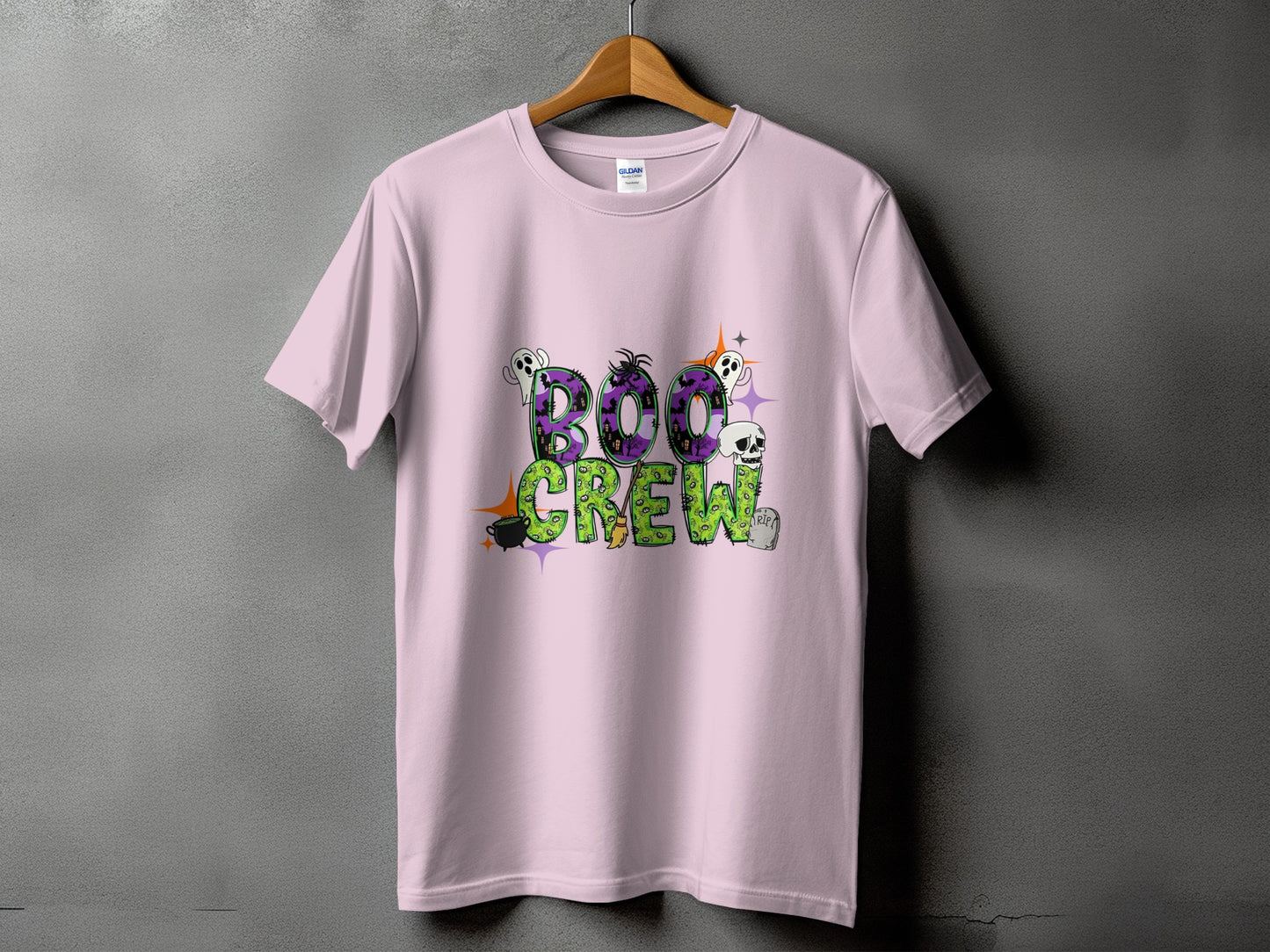 Pink t-shirt with "Boo Crew" text and Halloween graphics.