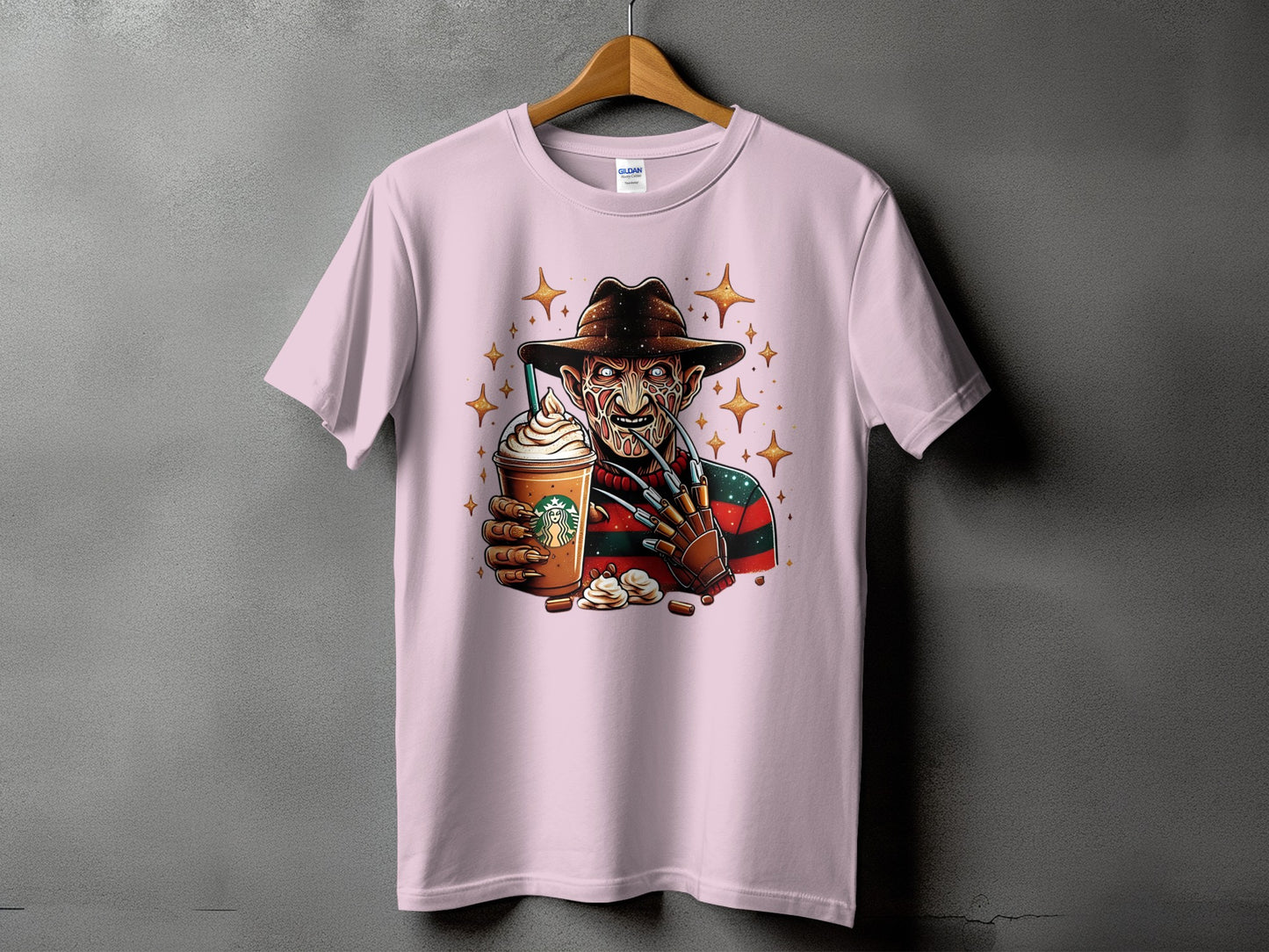 Pink t-shirt with Freddy Krueger holding a Starbucks coffee cup.