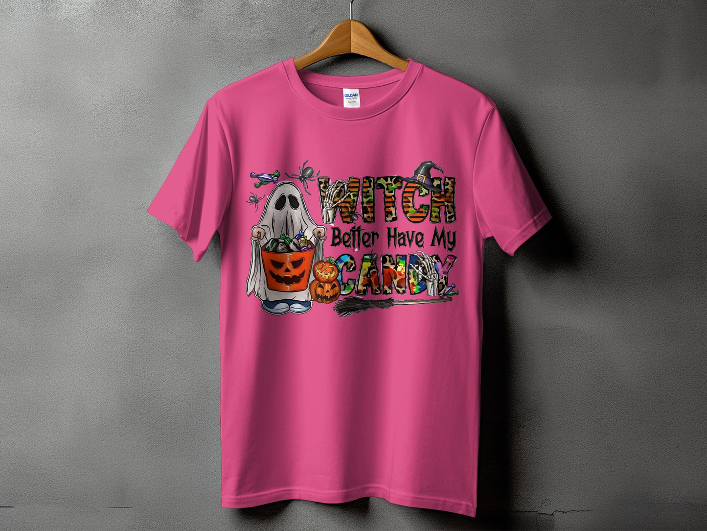 Pink t-shirt with ghost, pumpkins, and "Witch Better Have My Candy" Halloween graphic.