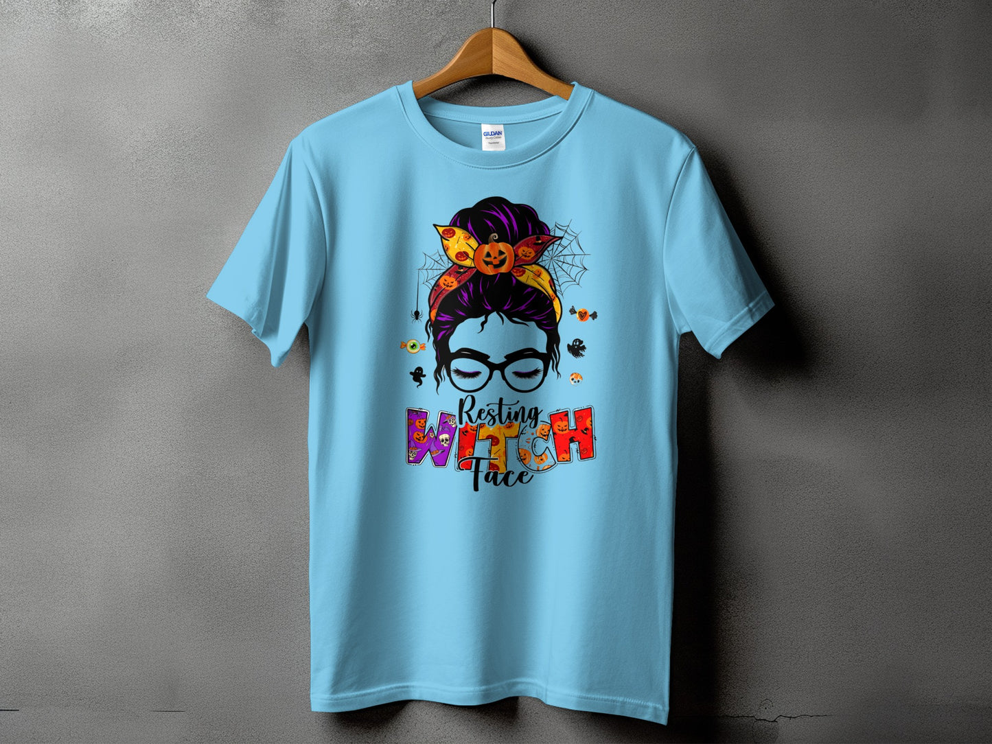Light blue t-shirt with "Resting Witch Face" text and Halloween graphics.