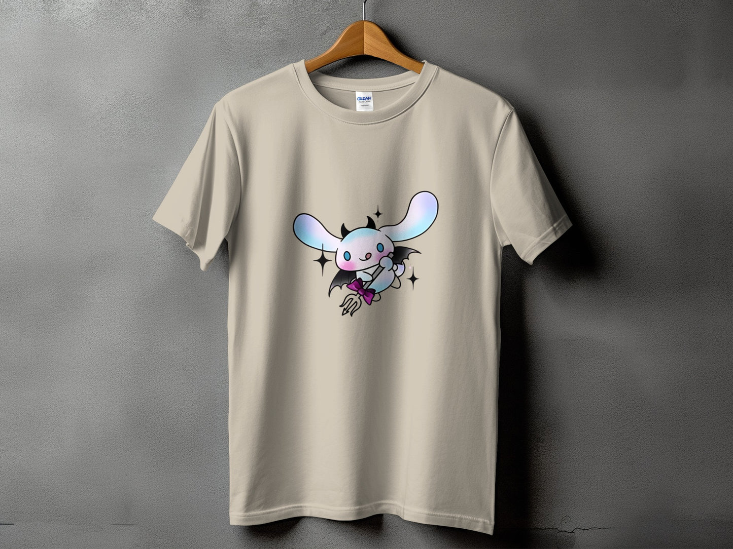 Tan t-shirt with a cute devilish bunny character holding a trident.