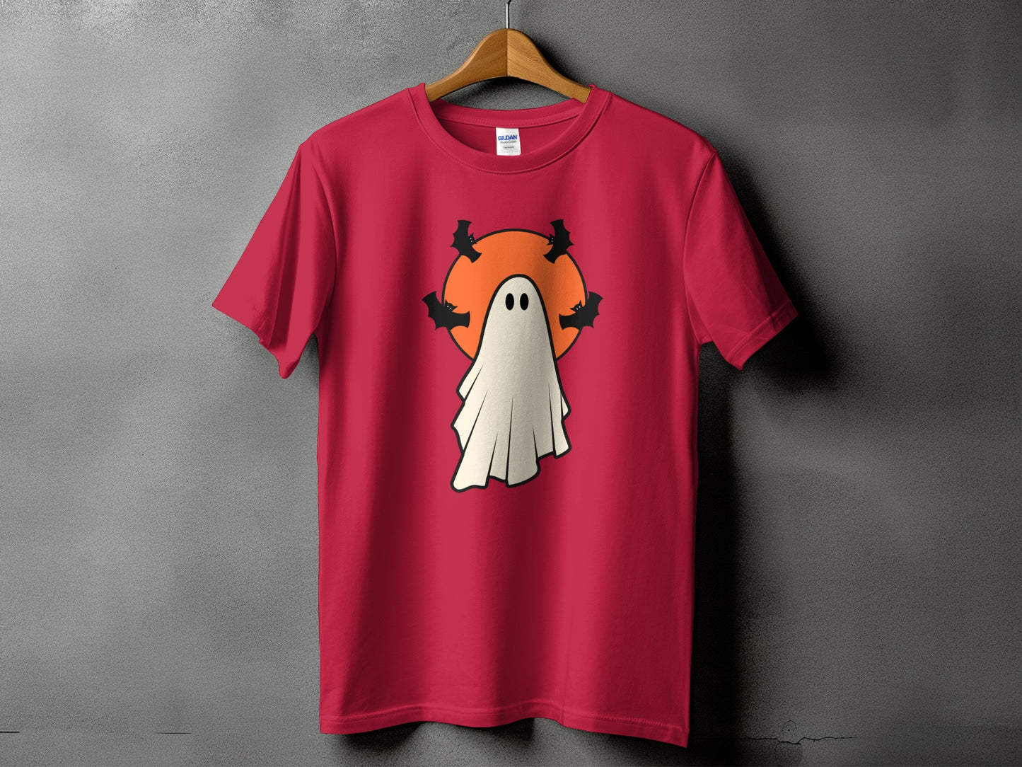 Red t-shirt with a cute ghost and bats graphic for Halloween.