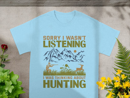 Light blue t-shirt with text "SORRY I WASN'T LISTENING I WAS THINKING ABOUT HUNTING" and hunting graphic.