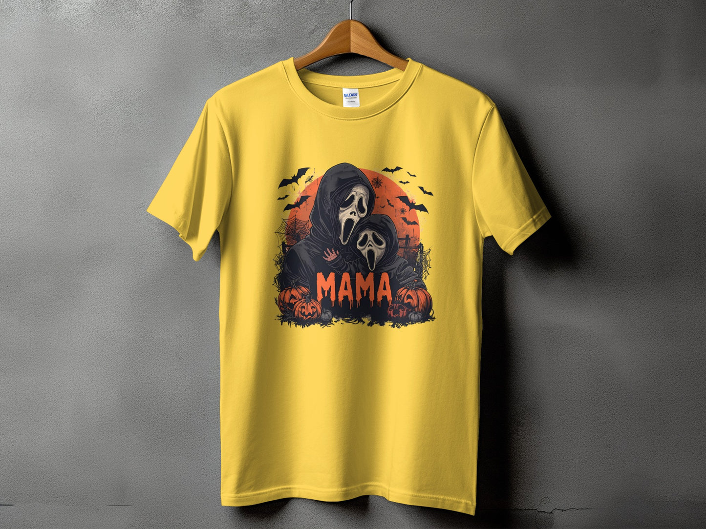 Yellow t-shirt with "Mama" text and two spooky ghost characters with pumpkins.