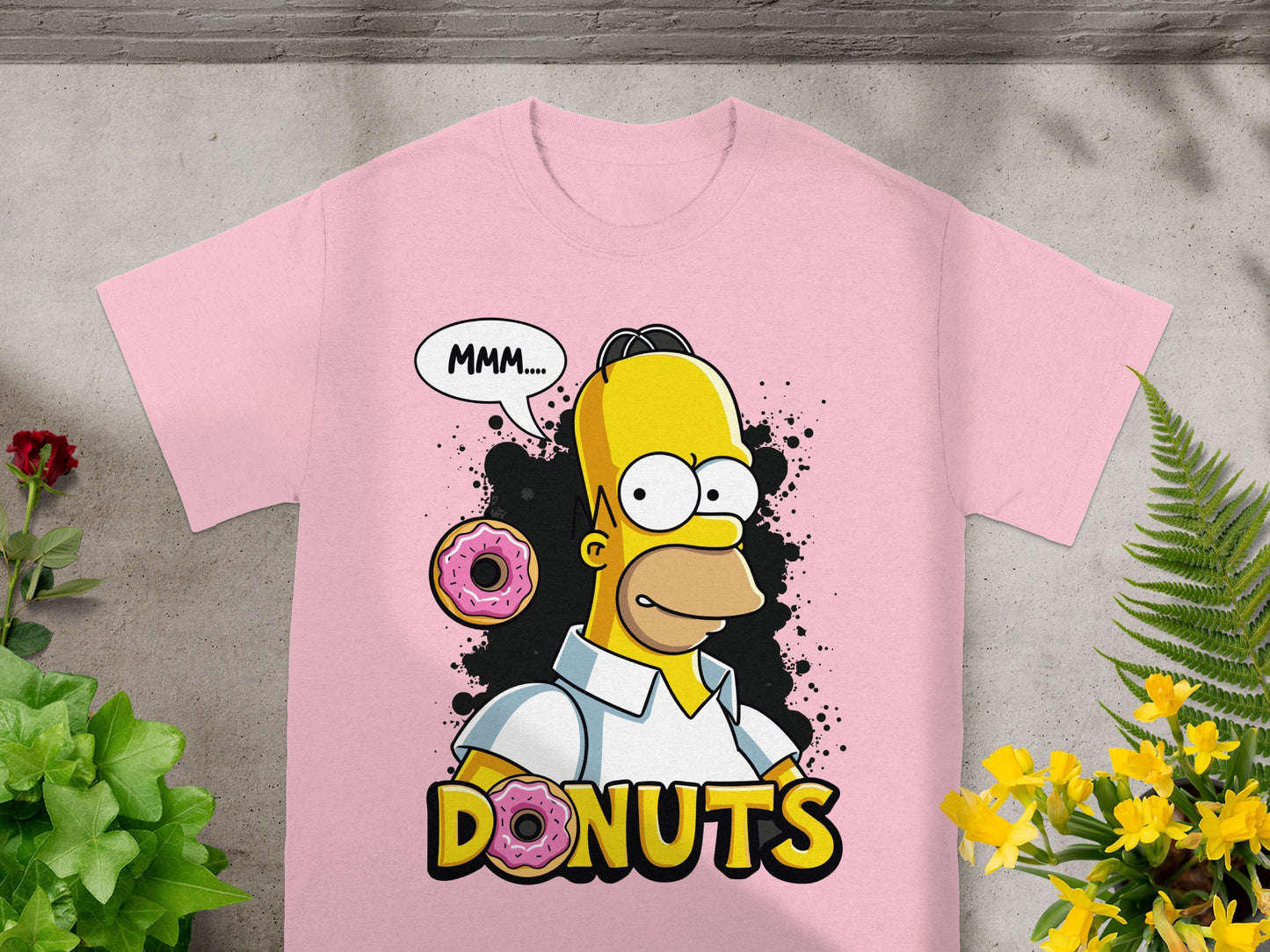 Pink t-shirt with Homer Simpson eating a donut, text "MMM...." and "DONUTS".